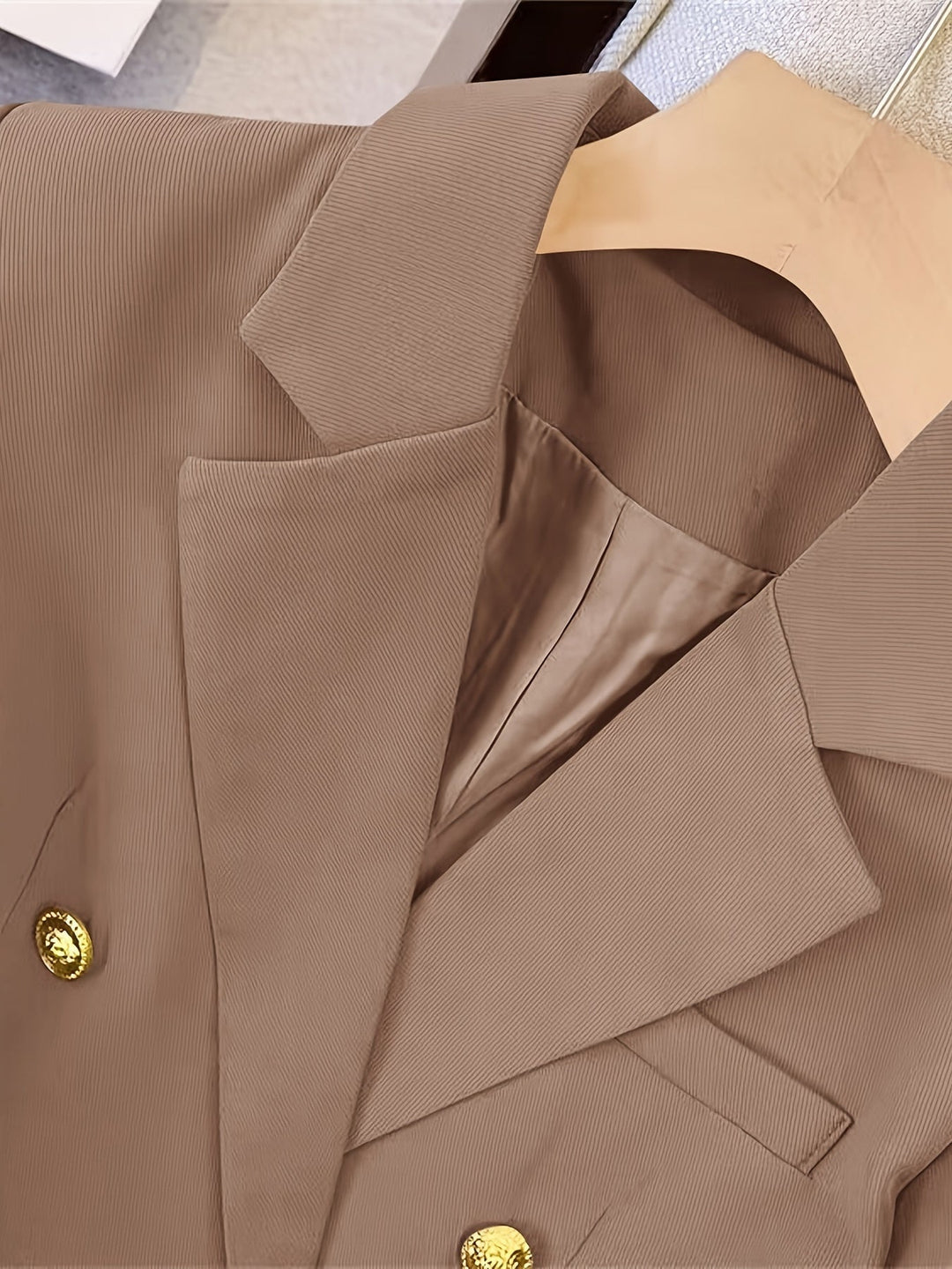 Gold button blazer women detail