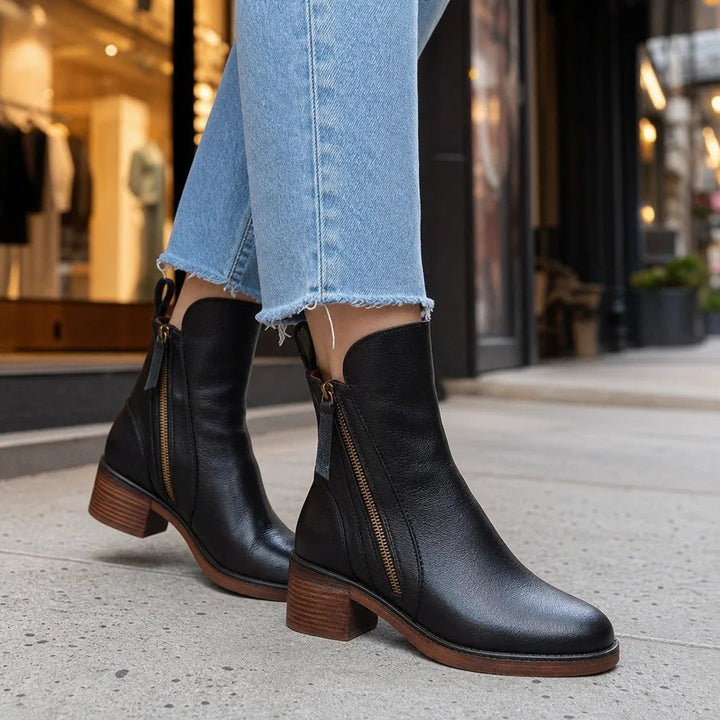 Exposed side zip ankle boots detail